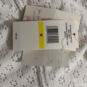 Jessica Simpson white one piece swimsuit